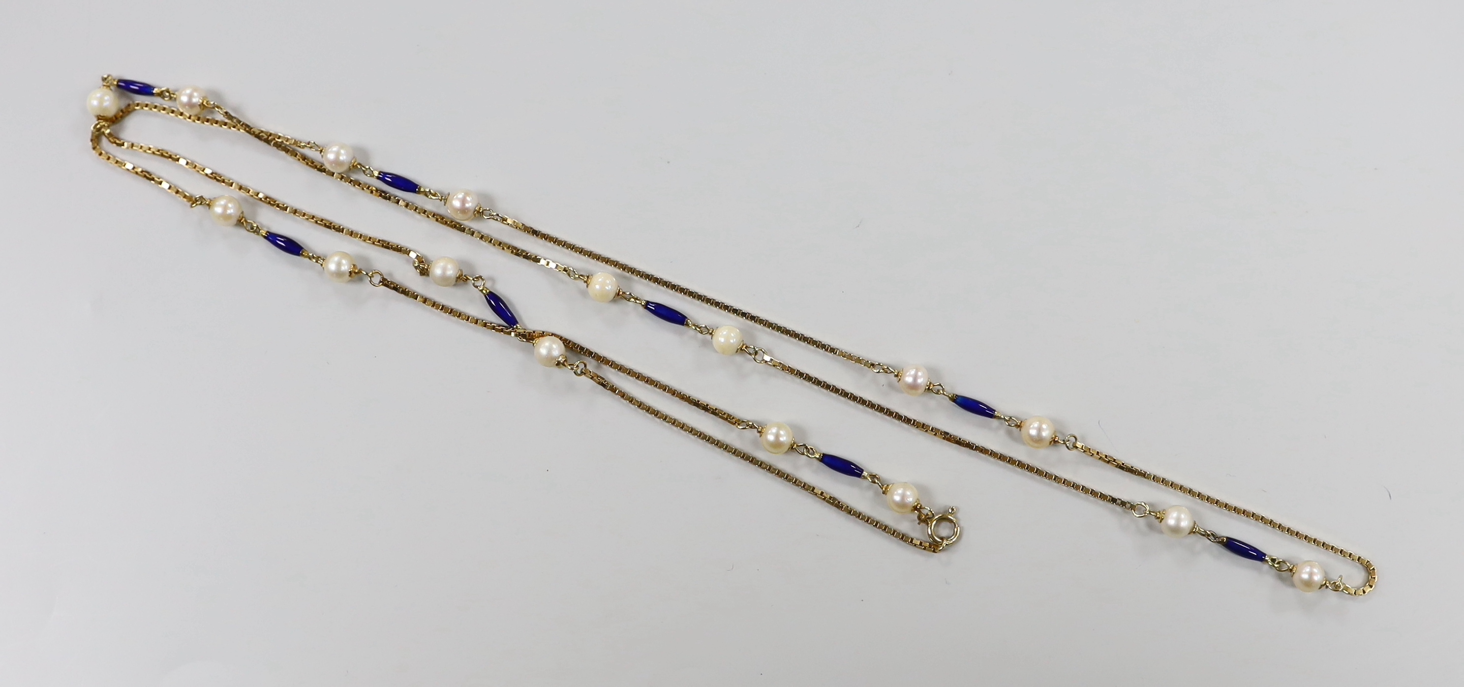 A mid to late 20th century Italian Uno-A-Erre 750 yellow metal, cultured pearl and blue enamelled baton link necklace, 94cm, gross weight 23.5 grams.
